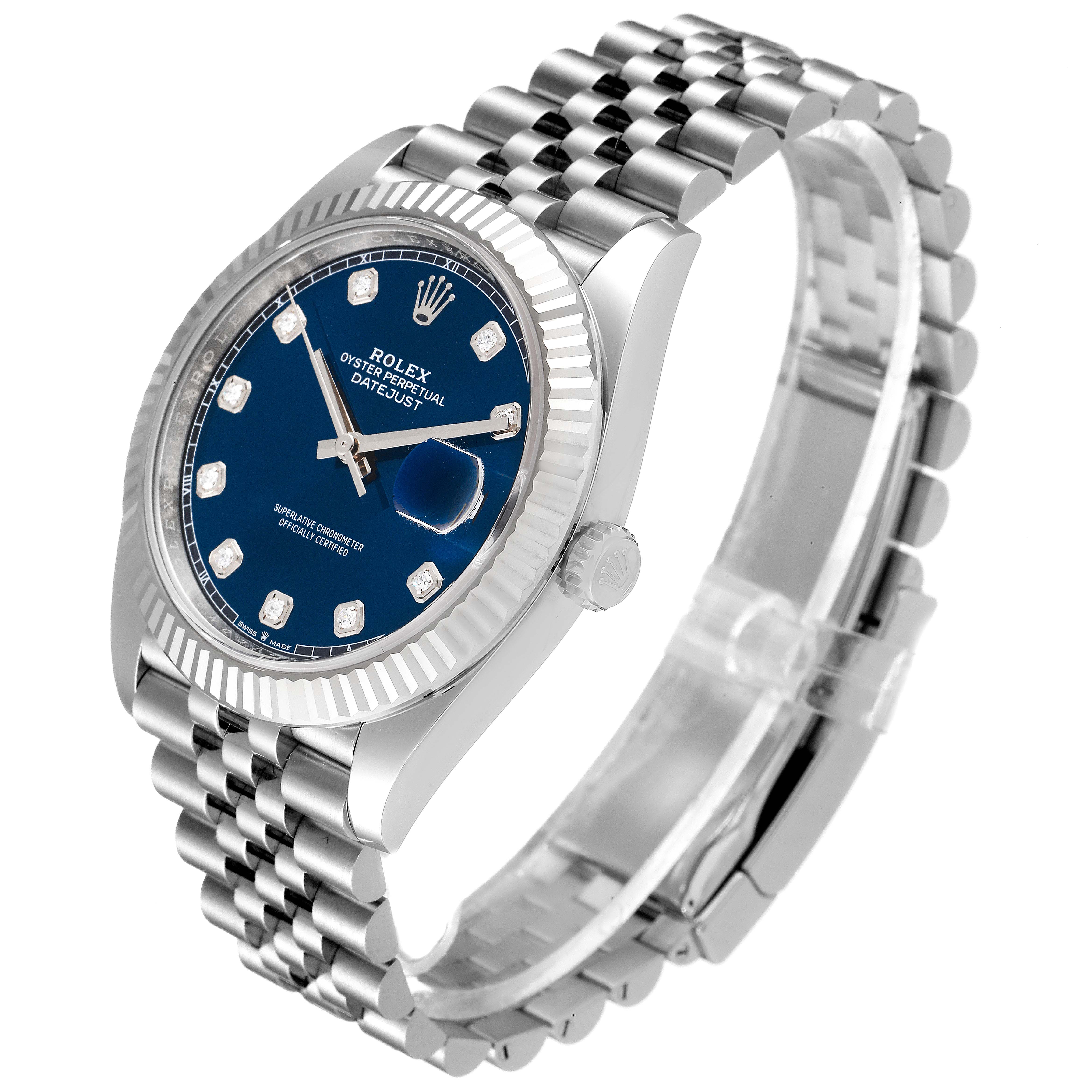 This Rolex Datejust 41 126334 Men
s Stainless Steel Blue Dial 126334 Men
s Stainless Steel Blue Dial watch is shown at an angled side view, highlighting its blue dial, fluted bezel, and jubilee bracelet.