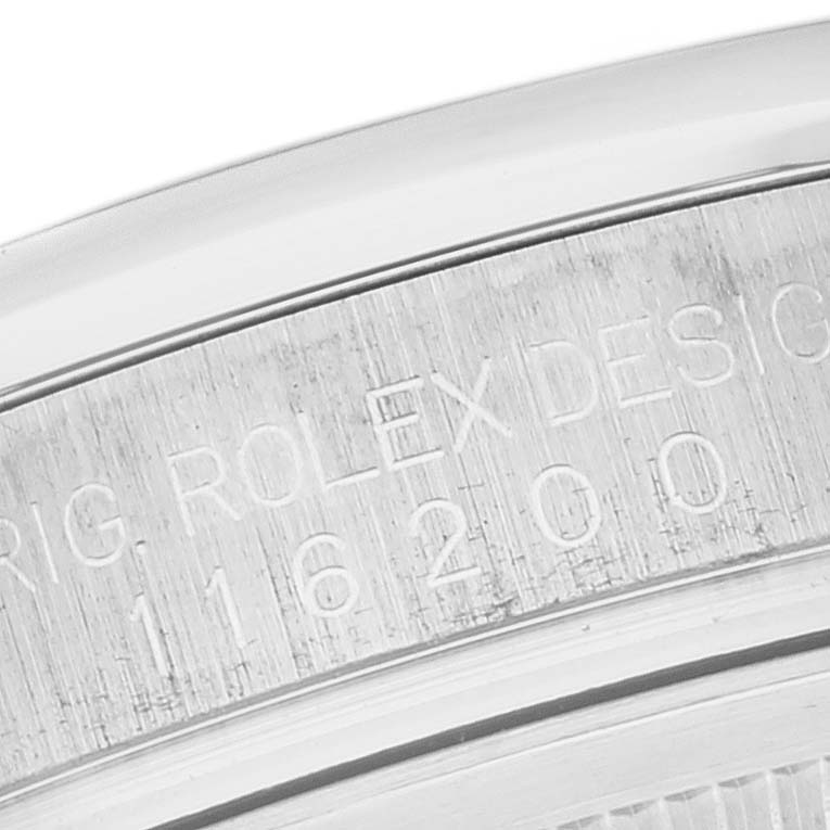 The image shows an up-close view of the engraving on the side of a Rolex Datejust 116200 Men's Stainless Steel Black Dial 116200 Men's Stainless Steel Black Dial watch case.