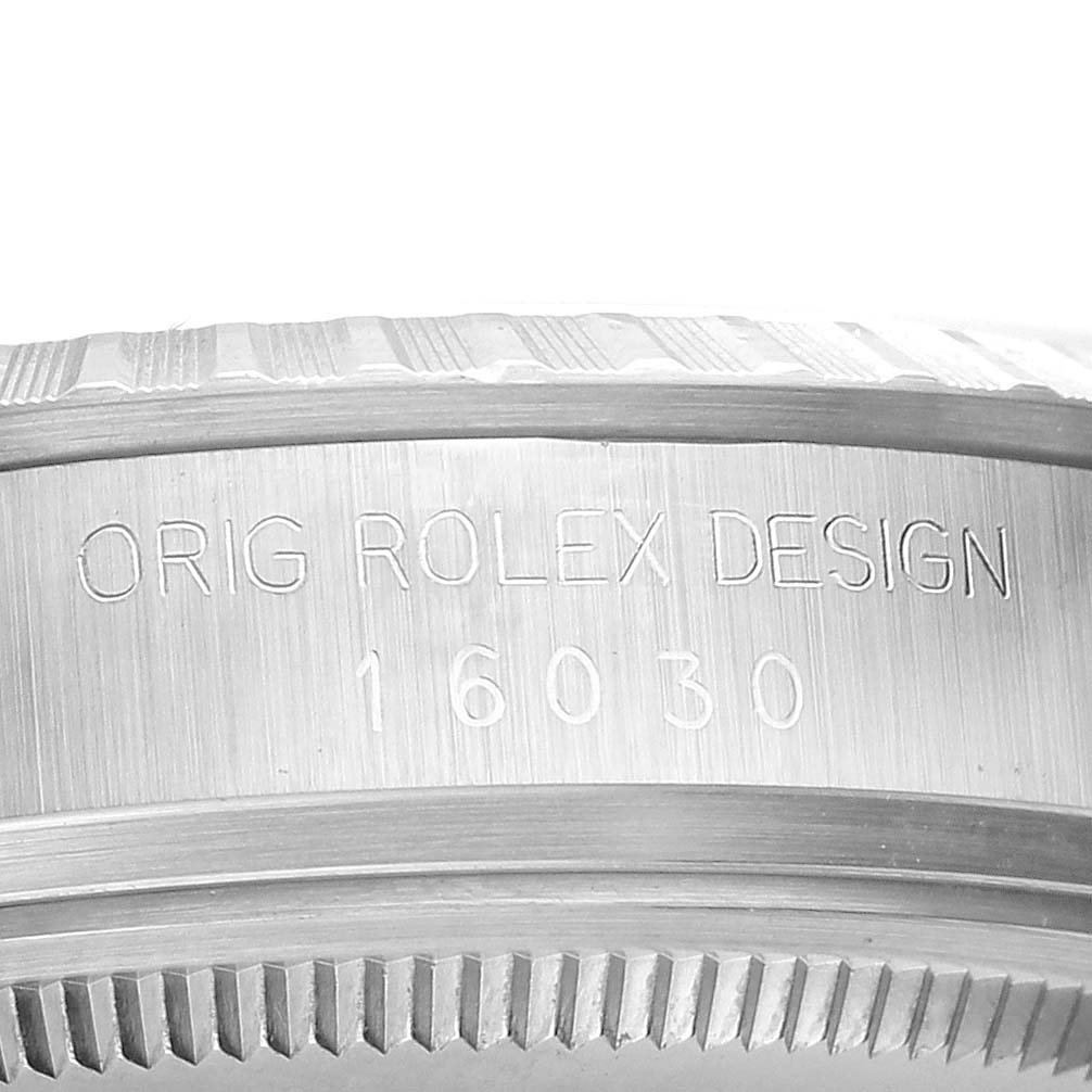 The image shows the engraved side of a Rolex Vintage Collection 16030 Men's Stainless Steel White Dial 16030 Men's Stainless Steel White Dial model, highlighting the design and model number.