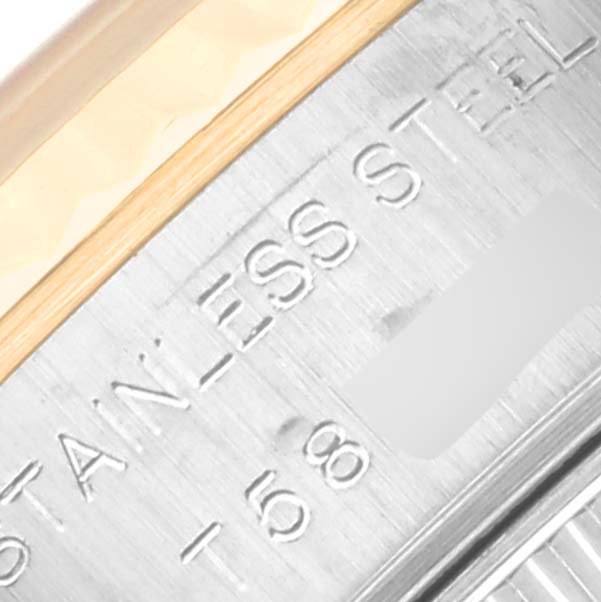 The image shows a close-up of the inner rim engraving on a Rolex Datejust 69173 Women's Steel and Gold (two tone) White Dial 69173 Women's Steel and Gold (two tone) White Dial watch, highlighting stainless steel text.