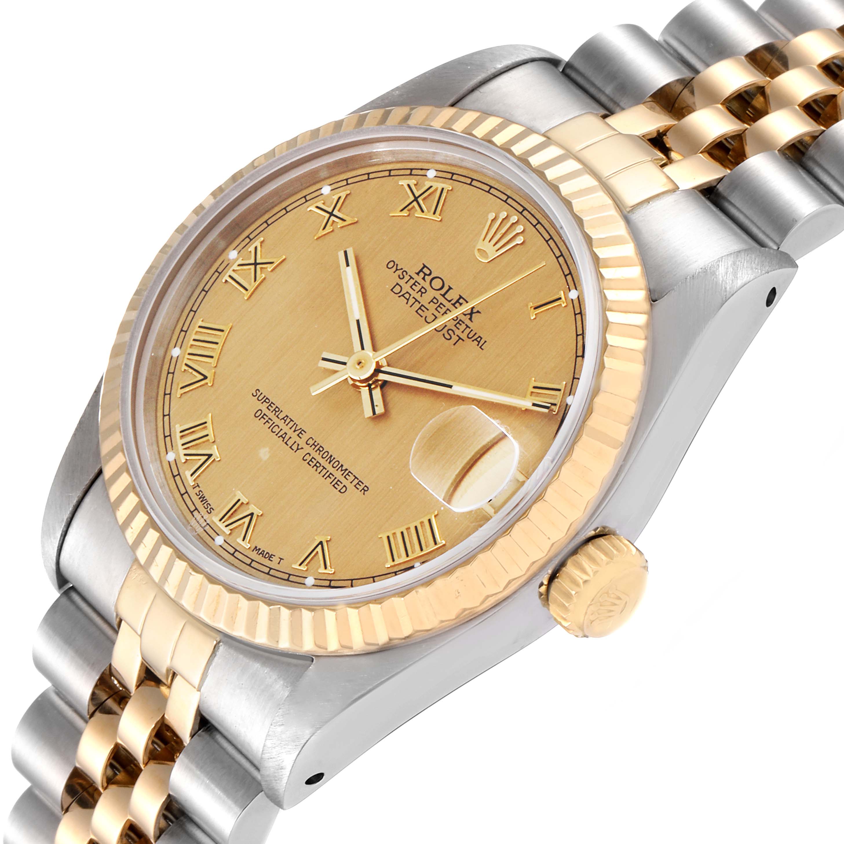 This image shows a Rolex Mid-Size 68273 Women's Steel and Gold (two tone) Champagne Dial 68273 Women's Steel and Gold (two tone) Champagne Dial Datejust watch at an angle highlighting the dial, bezel, crown, and part of the bracelet.