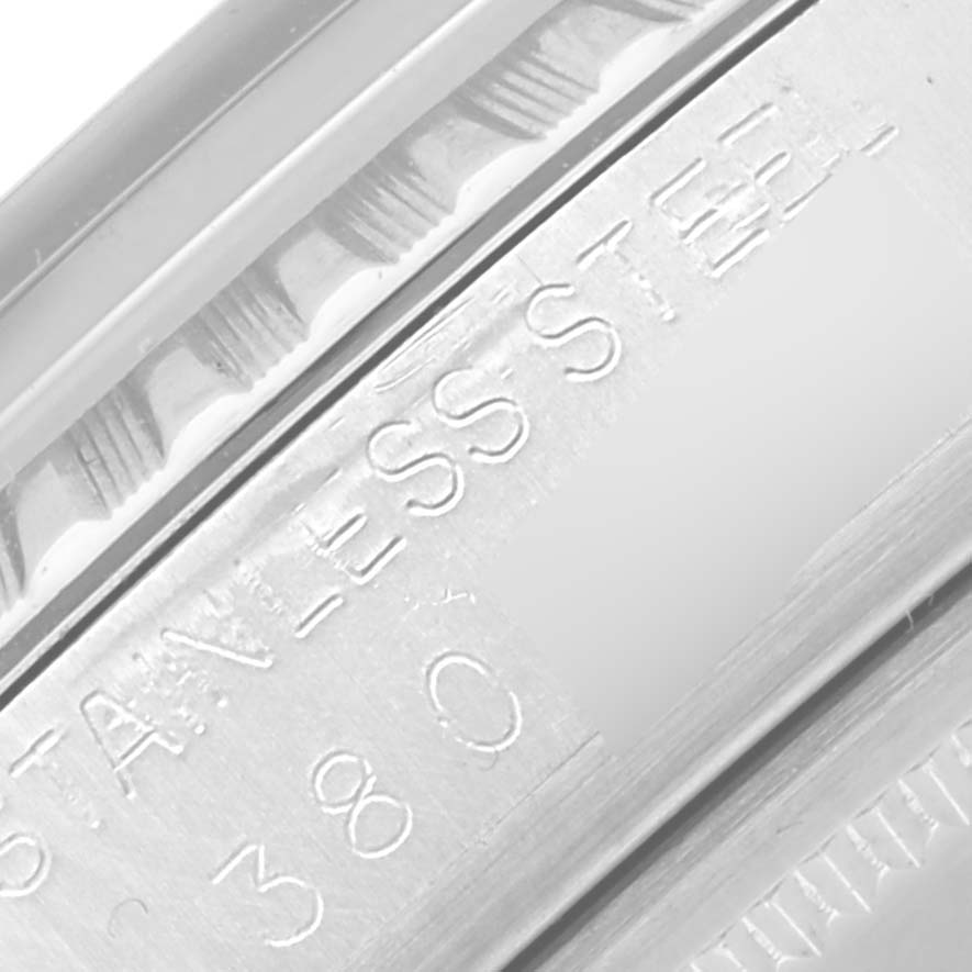 The image shows a close-up of the engraved side, likely the case edge, of the Vintage Collection model by Rolex.
