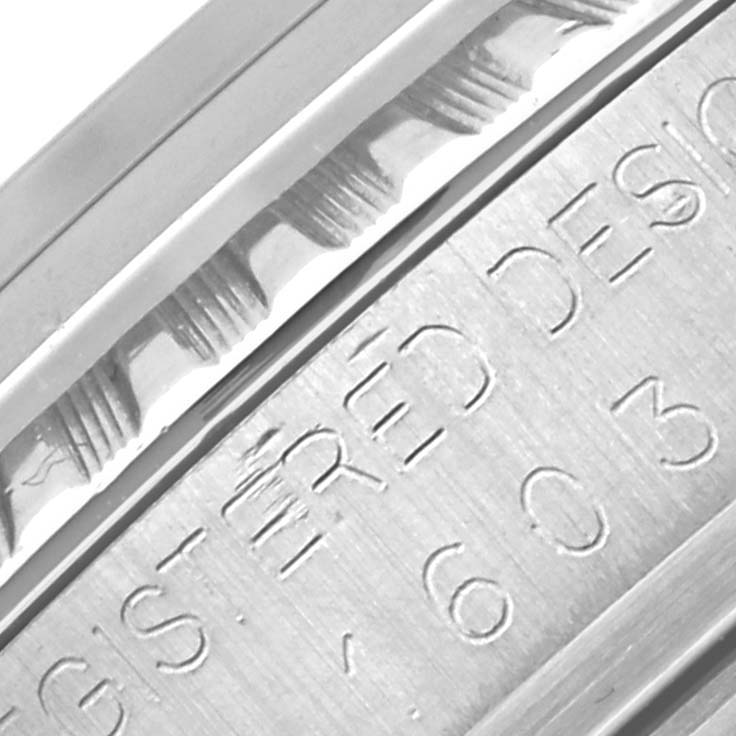 The image shows the engraved details on the side of a Vintage Collection model by Rolex, highlighting the texture and markings.