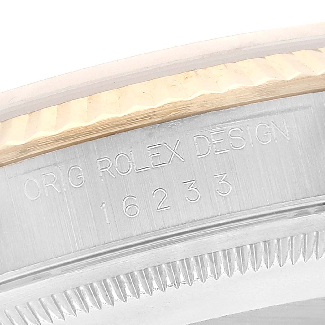 The image shows a close-up of the case side of a Rolex Datejust 16233 Men's Steel and Gold (two tone) Champagne Dial 16233 Men's Steel and Gold (two tone) Champagne Dial model 16233, displaying the brand engraving.