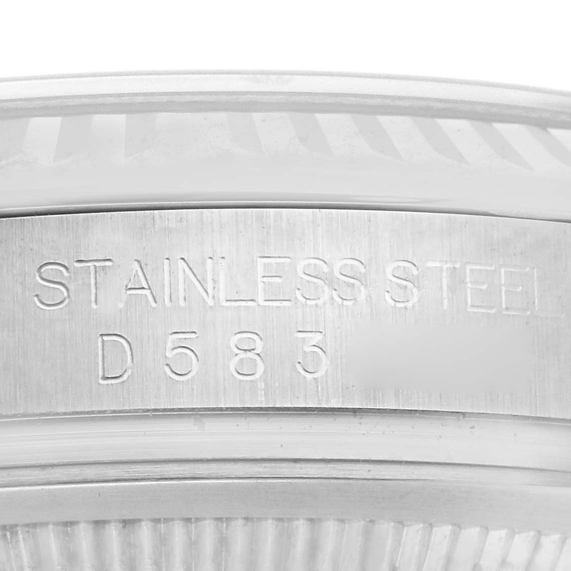 The image shows a close-up of the case side of a Rolex Datejust 116234 Men
s Stainless Steel Black Dial 116234 Men
s Stainless Steel Black Dial, highlighting the "STAINLESS STEEL" engraving.