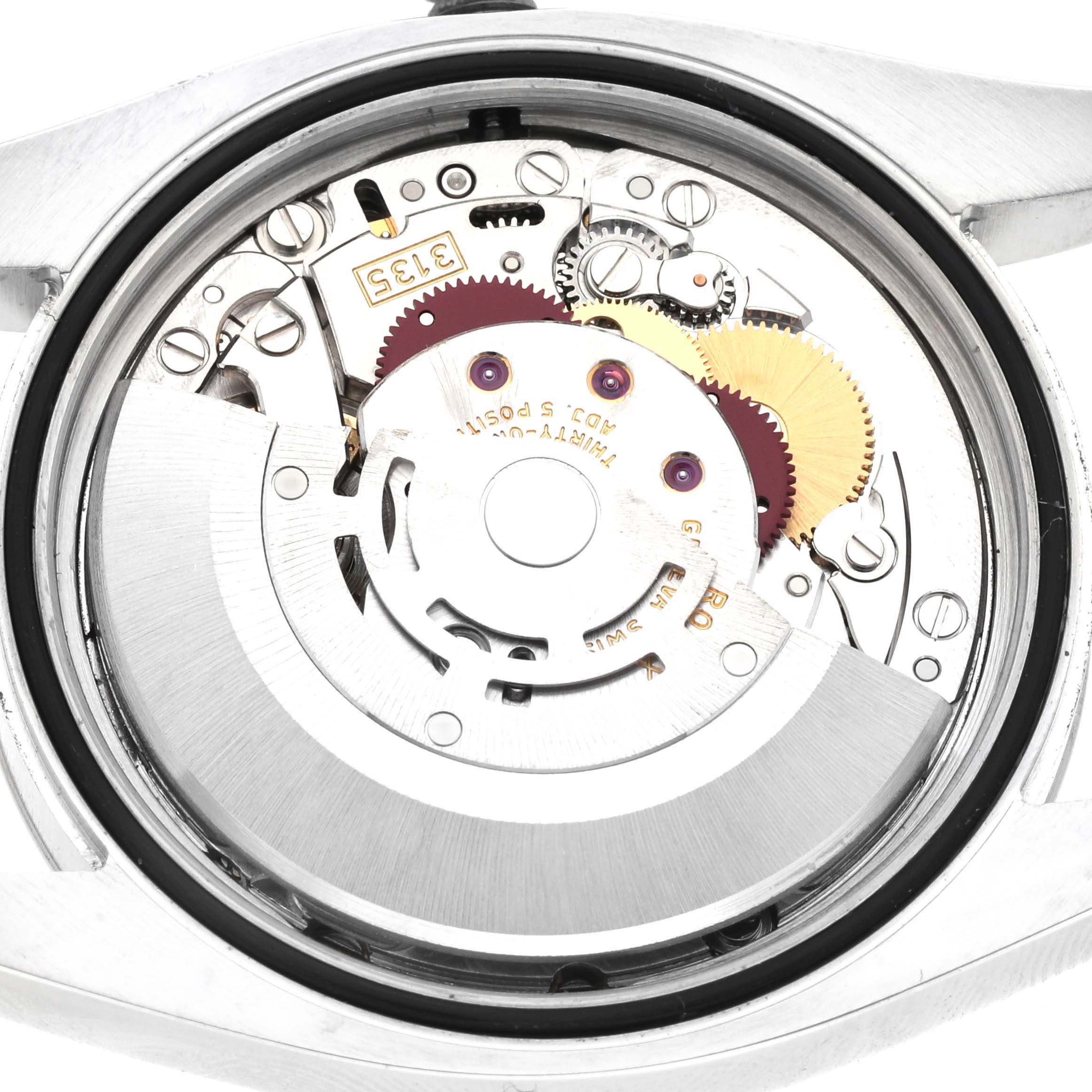 The image shows the internal mechanical movement of a Rolex Datejust 116234 Men
s Stainless Steel Black Dial 116234 Men
s Stainless Steel Black Dial watch from a rear view angle.