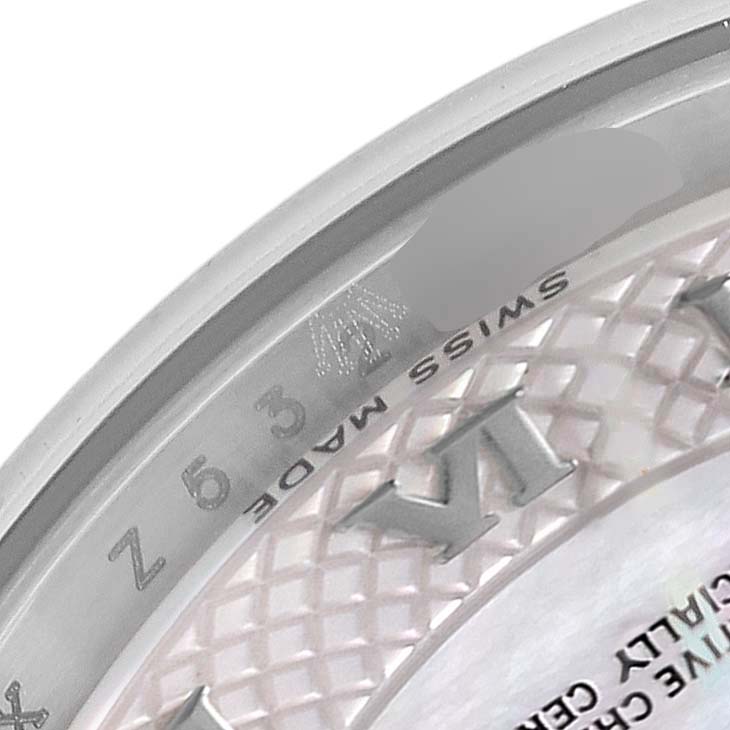 This image shows a close-up of the dial and inner bezel of a Rolex Datejust 179174 Women's Stainless Steel Mother of Pearl Dial 179174 Women's Stainless Steel Mother of Pearl Dial watch, displaying the "Swiss Made" text and part of a Roman numeral.