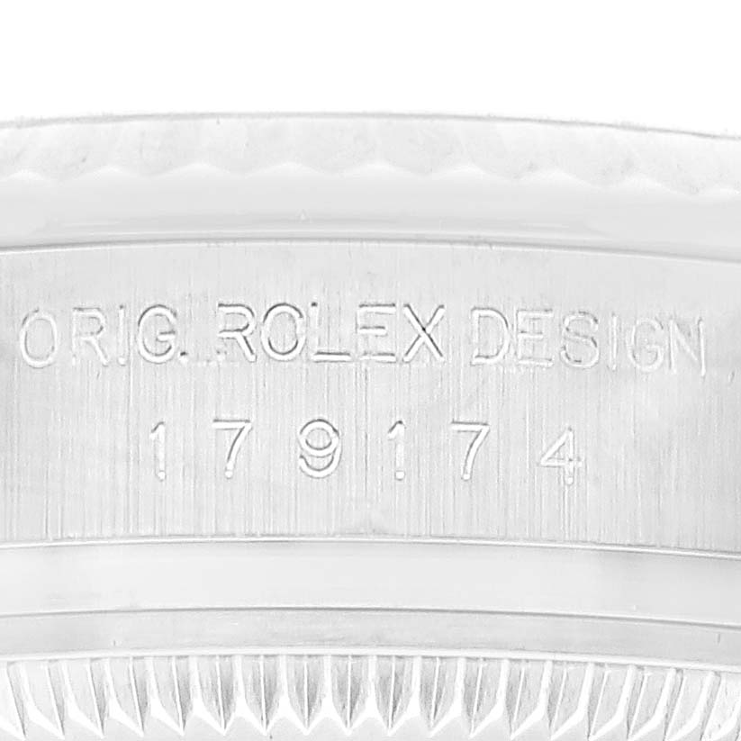 This image shows a close-up of the engraving on the case side of a Rolex Datejust 179174 Women's Stainless Steel Silver Dial 179174 Women's Stainless Steel Silver Dial watch.