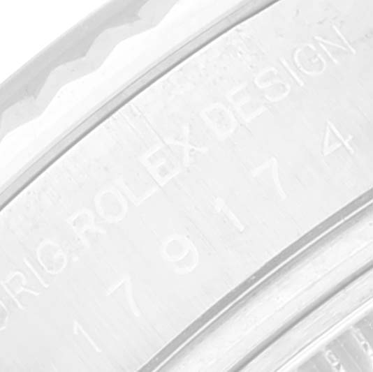 The image shows a close-up of the engraved bezel of a Rolex Datejust 179174 Women's Stainless Steel Mother of Pearl Dial 179174 Women's Stainless Steel Mother of Pearl Dial watch, highlighting the model details.