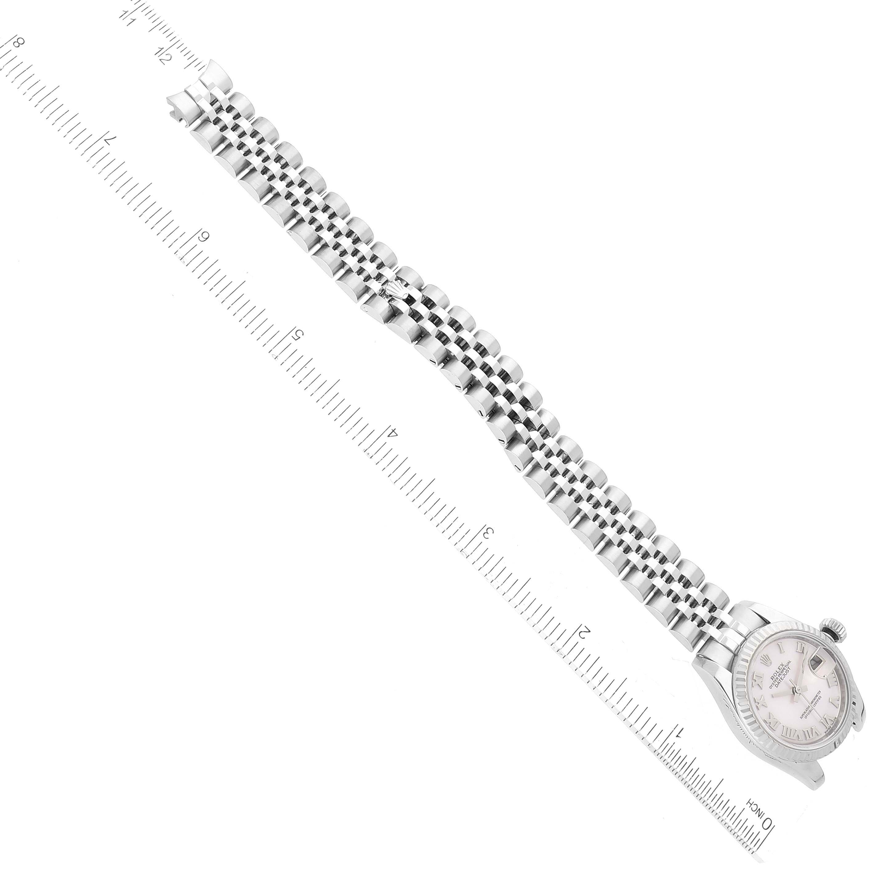 The image shows a Rolex Datejust 179174 Women's Stainless Steel Mother of Pearl Dial 179174 Women's Stainless Steel Mother of Pearl Dial watch laid out flat with a ruler measuring the length of its bracelet.