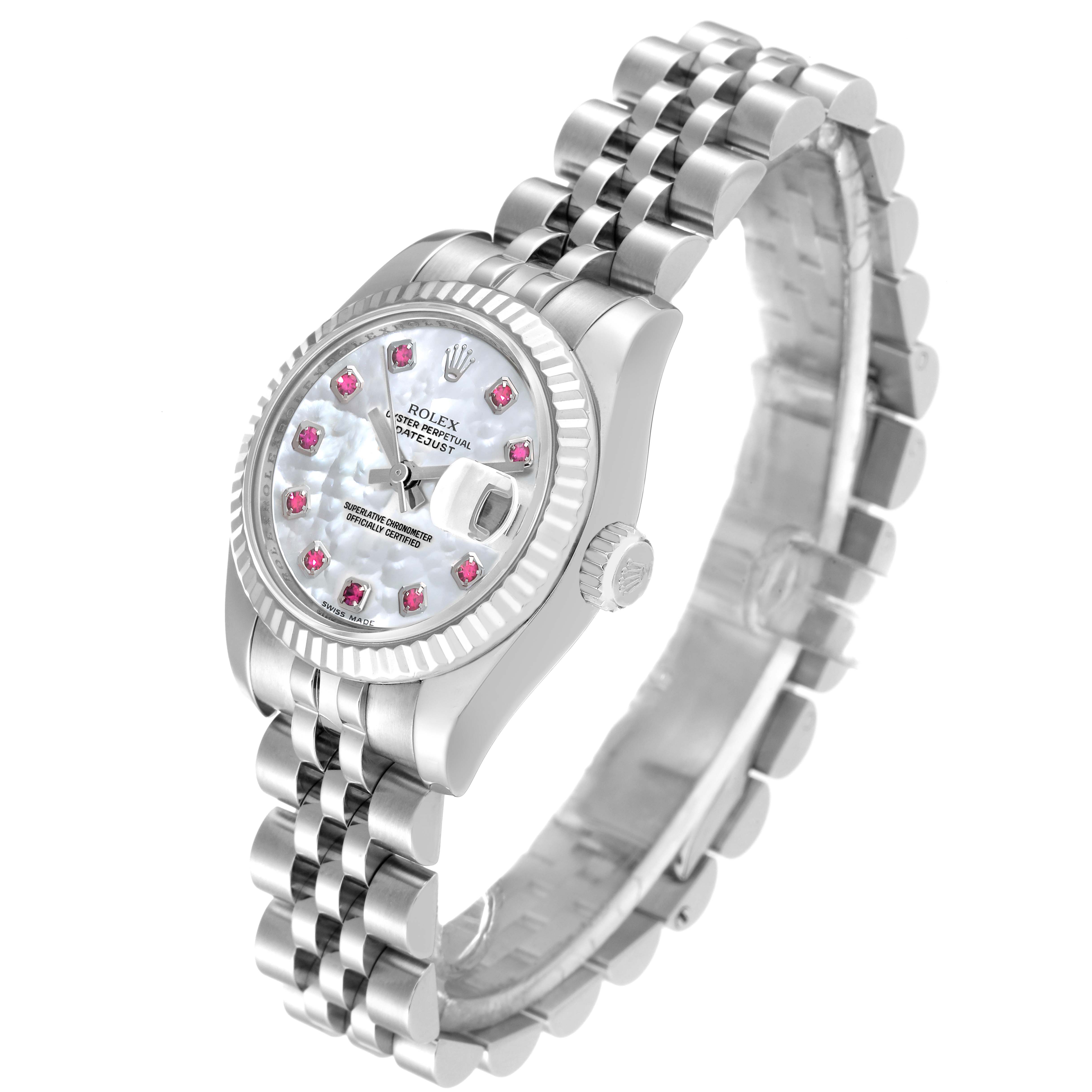 This image shows a side angle of a Rolex Datejust 179174 Women's Stainless Steel Mother of Pearl Dial 179174 Women's Stainless Steel Mother of Pearl Dial watch, highlighting its dial, fluted bezel, bracelet, and the crown.