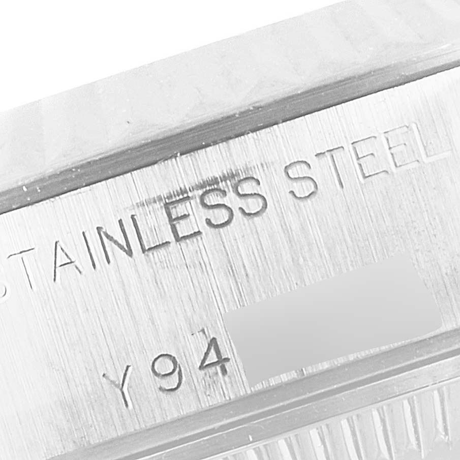 The image shows a close-up angle of the stainless steel casing with part of the serial number on a Rolex Datejust 79174 Women
s Stainless Steel Silver Dial 79174 Women
s Stainless Steel Silver Dial watch.