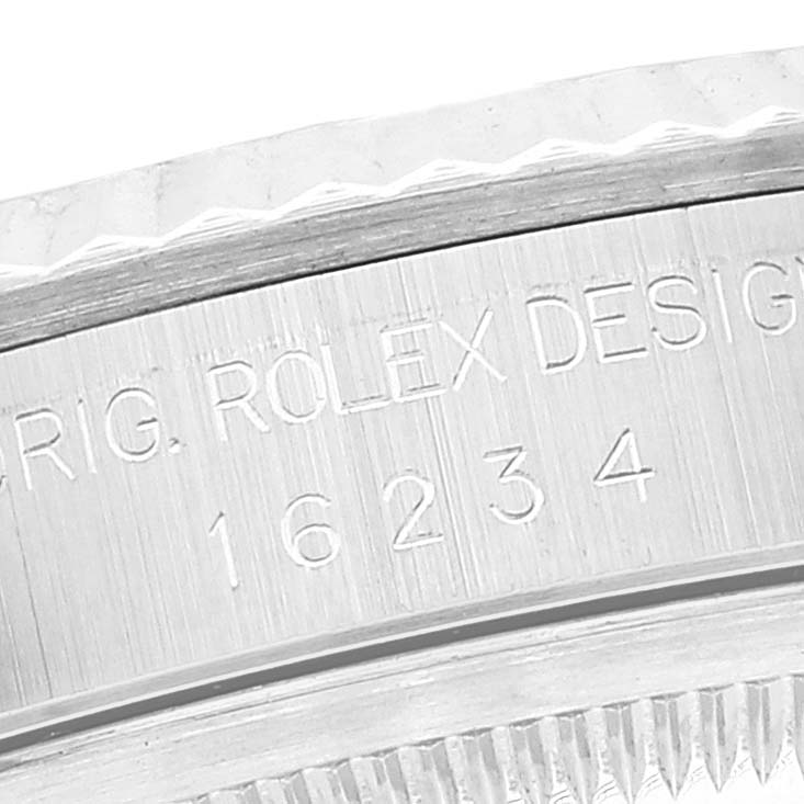This image shows a close-up of the engraved bezel of a Rolex Datejust 16234 Men's Stainless Steel Silver Dial 16234 Men's Stainless Steel Silver Dial watch, displaying the model number 16234.