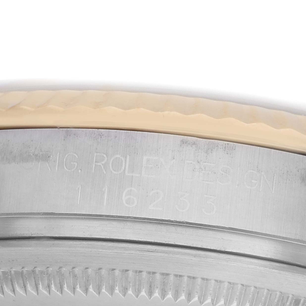 The image shows the side of a Rolex Datejust 116233 Men
s Steel and Gold (two tone) Champagne Dial watch with visible model engraving on the case.