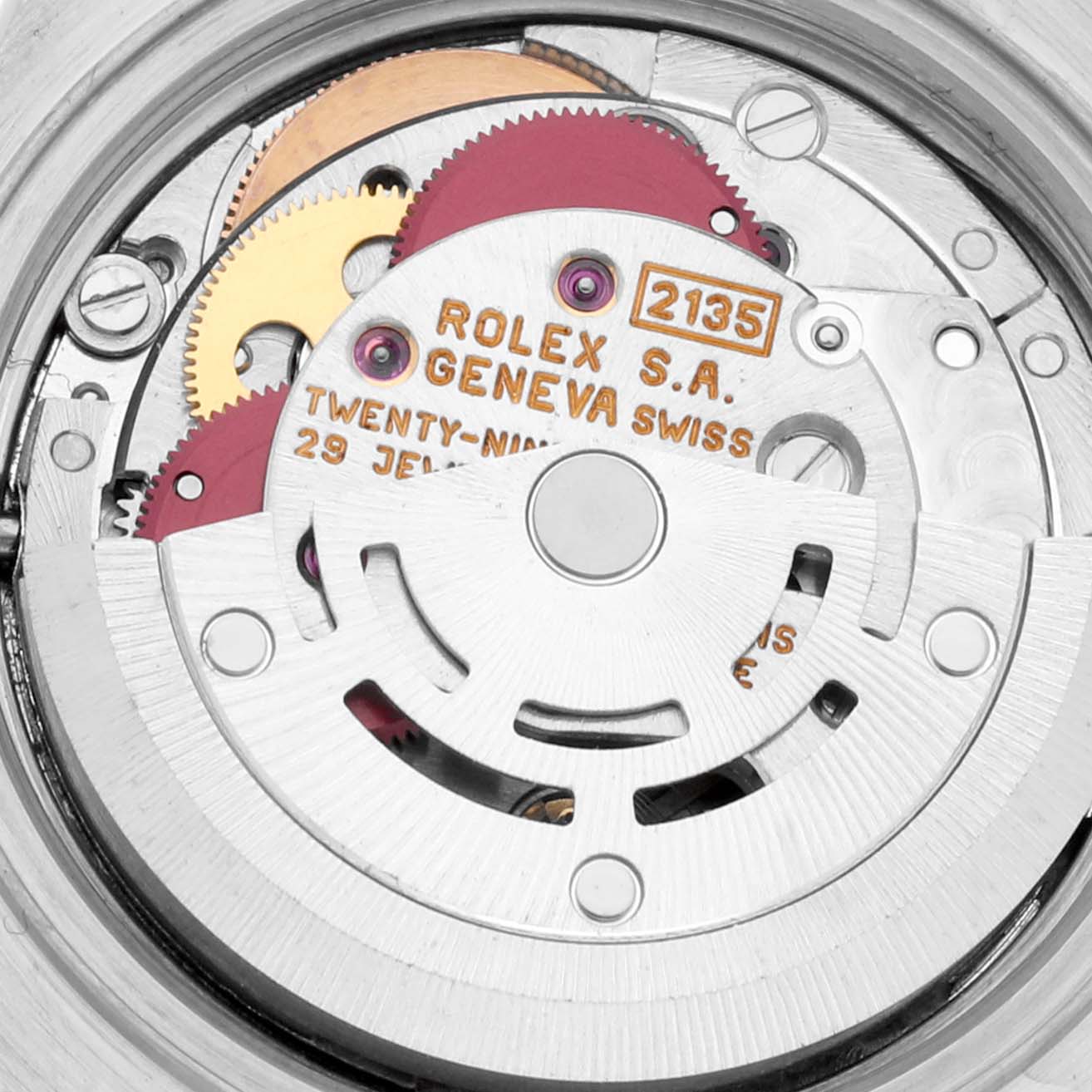 The image shows the intricate internal mechanism of the Rolex Datejust 69173 Women's Steel and Gold (two tone) Champagne Dial 69173 Women's Steel and Gold (two tone) Champagne Dial watch, highlighting the gears and rotor.