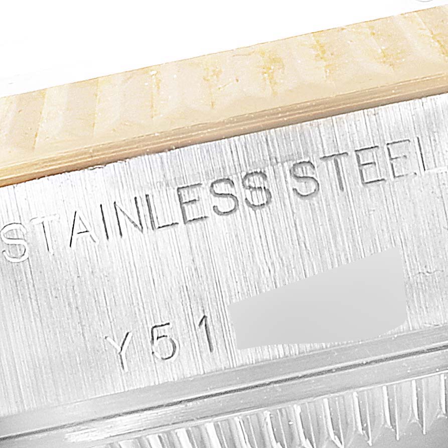 The image shows a close-up of the steel side of a Rolex Datejust 79173 Women's Steel and Gold (two tone) Champagne Dial 79173 Women's Steel and Gold (two tone) Champagne Dial watch, displaying part of the stainless steel marking.