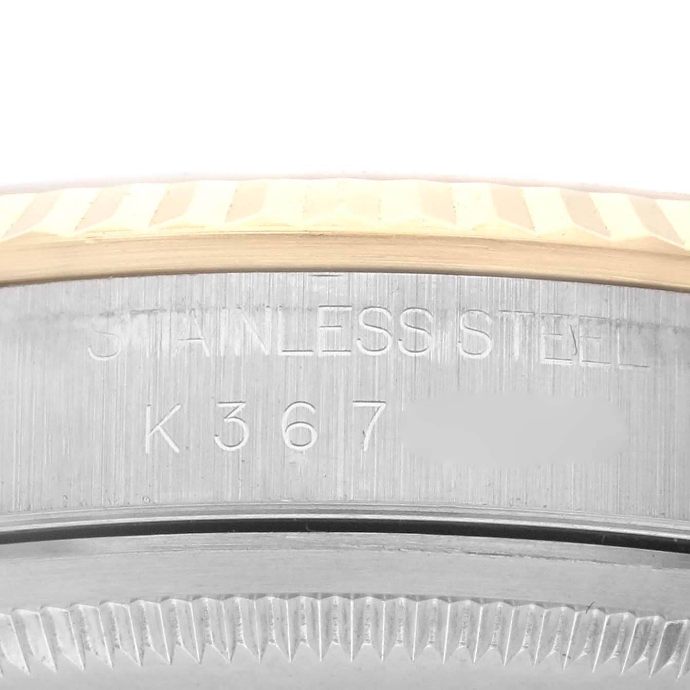 The image shows a close-up of the side engraving and stainless steel back of a Rolex Datejust 16233 Men's Steel and Gold (two tone) Champagne Dial 16233 Men's Steel and Gold (two tone) Champagne Dial watch.