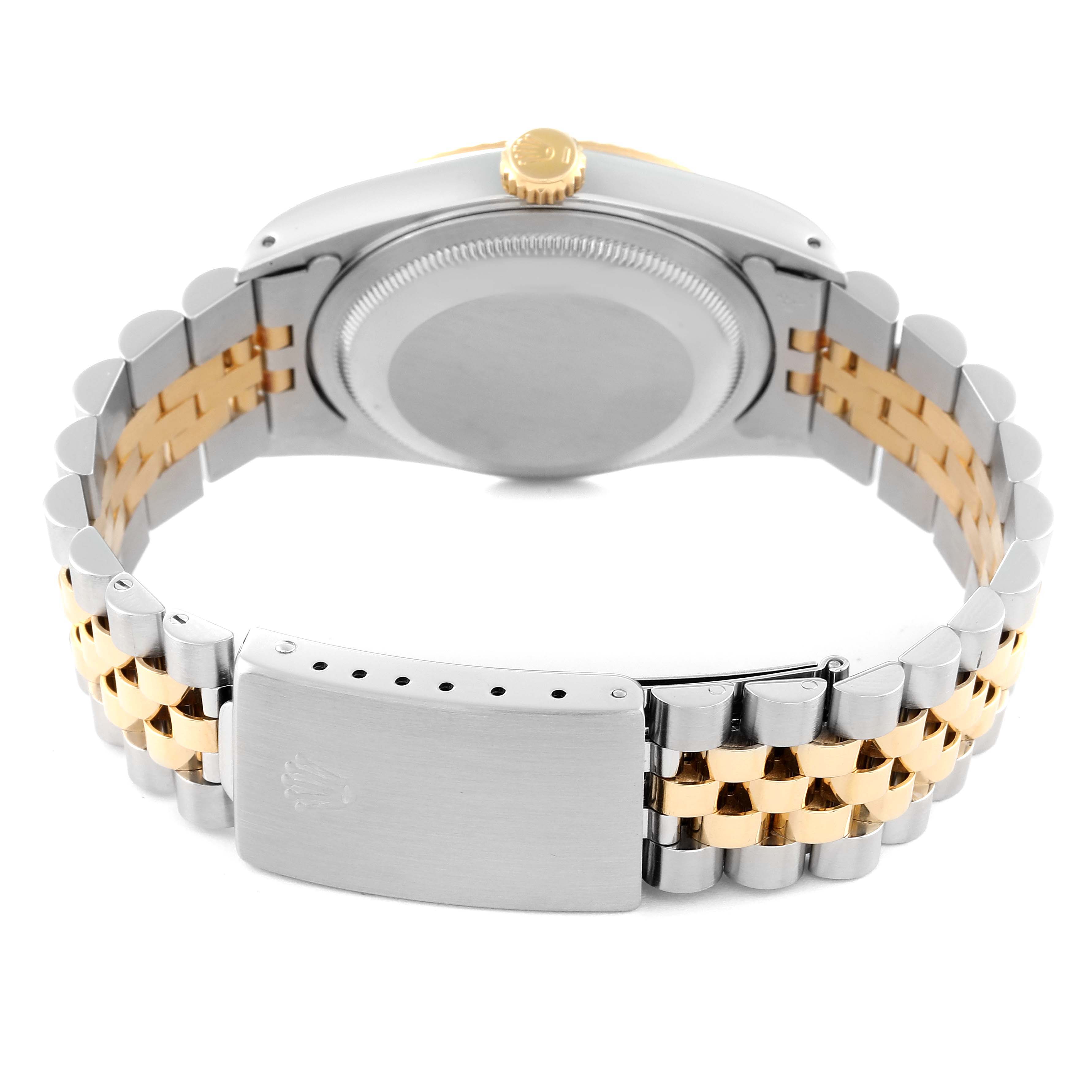 This image shows the back view of the Rolex Datejust 16233 Men's Steel and Gold (two tone) Champagne Dial 16233 Men's Steel and Gold (two tone) Champagne Dial watch, highlighting its clasp, bracelet, and case back.