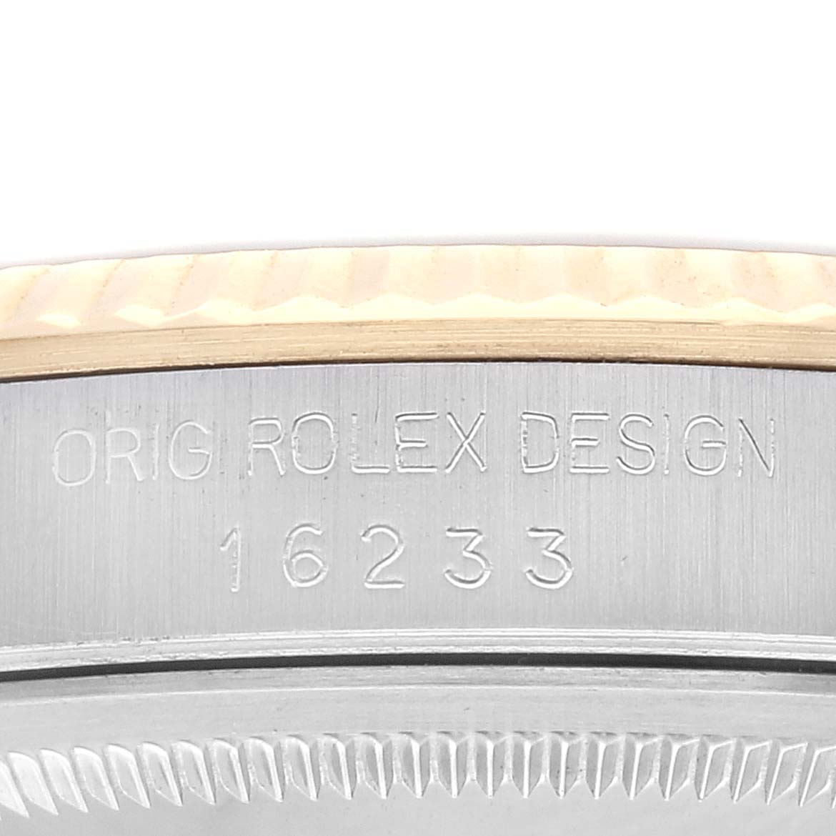 The image shows a close-up of the case with engraving details of the Rolex Datejust 16233 Men's Steel and Gold (two tone) Champagne Dial 16233 Men's Steel and Gold (two tone) Champagne Dial, including the model number 16233.
