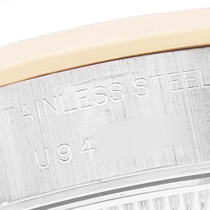 The image shows a close-up of the serial number and "STAINLESS STEEL" engraved on the casing of a Rolex Datejust 69163 Women's Steel and Gold (two tone) Grey Dial 69163 Women's Steel and Gold (two tone) Grey Dial watch.
