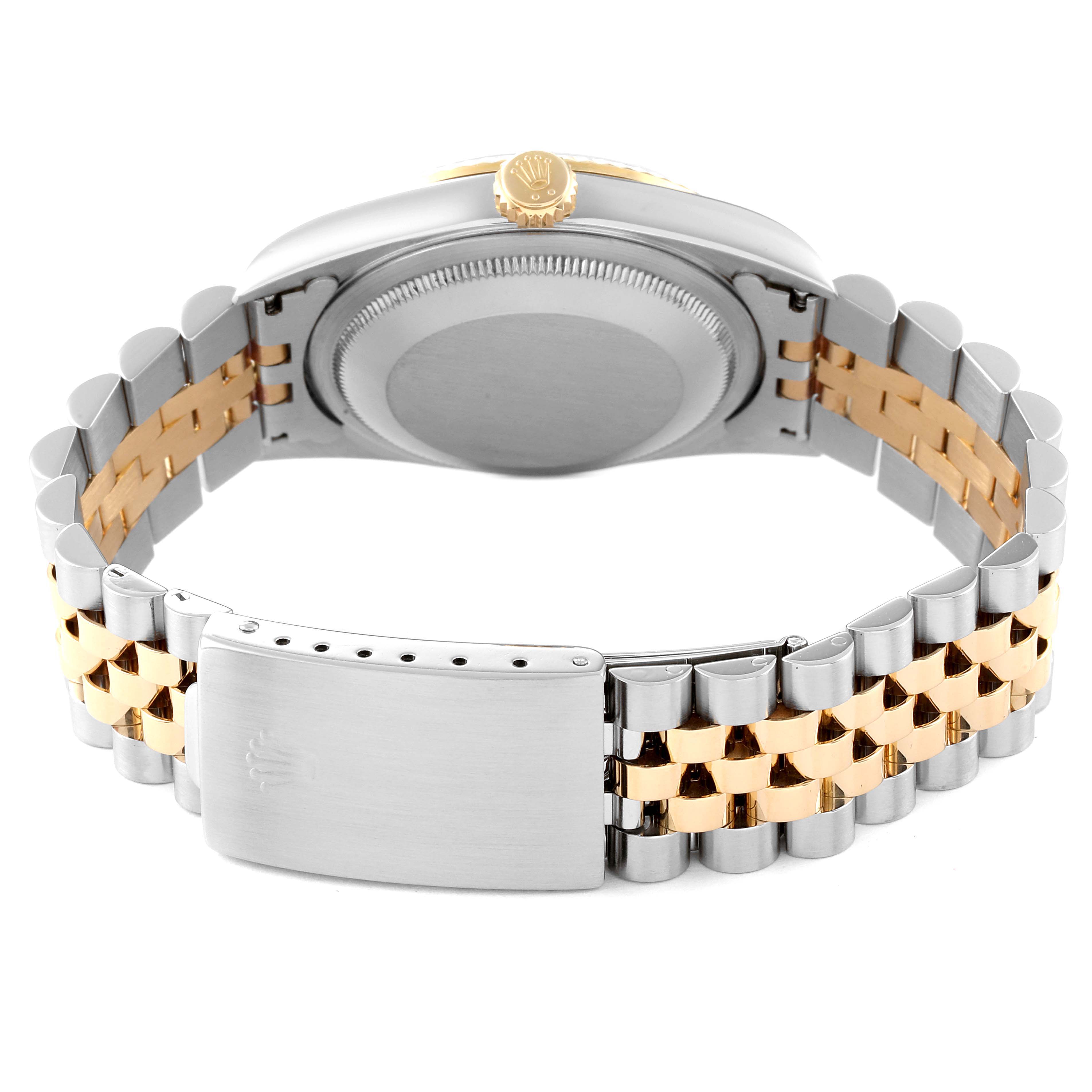 The image shows the back of a Rolex Datejust 16233 Men
s Steel and Gold (two tone) Grey Dial 16233 Men
s Steel and Gold (two tone) Grey Dial watch, highlighting its two-tone bracelet and clasp.