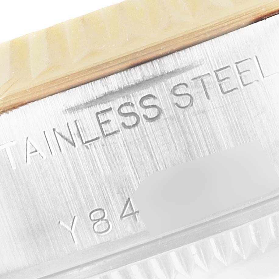 The image shows a close-up of the stainless steel part and serial number on a Rolex Datejust 79173 Women's Steel and Gold (two tone) White Dial 79173 Women's Steel and Gold (two tone) White Dial watch.