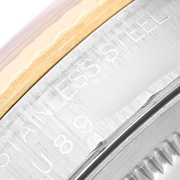 The image shows a close-up of the side of a Rolex Datejust 16233 Men's Steel and Gold (two tone) Blue Dial 16233 Men's Steel and Gold (two tone) Blue Dial watch, highlighting the stainless steel and gold bezel.