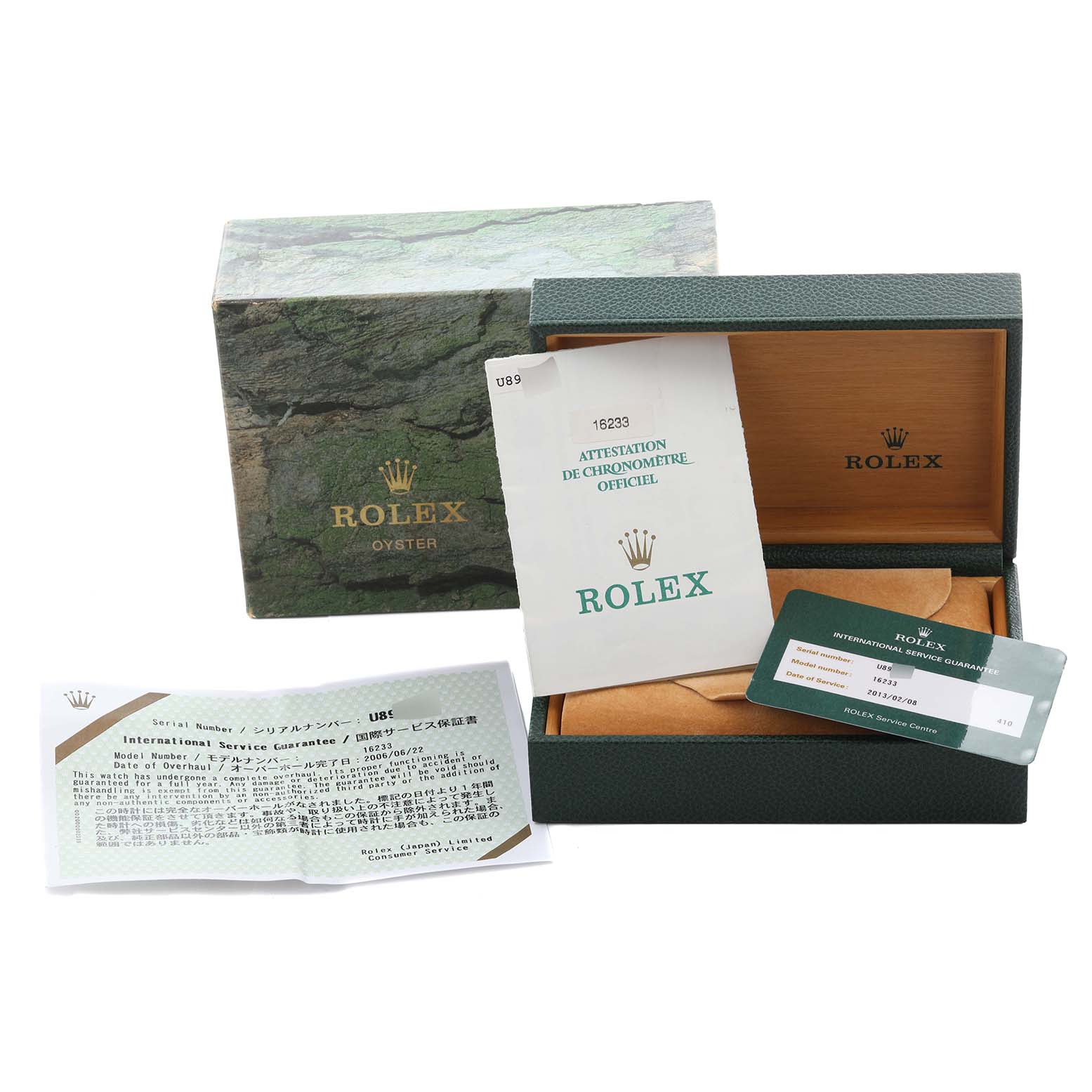The image shows the packaging, papers, and a service card for the Rolex Datejust 16233 Men's Steel and Gold (two tone) Blue Dial 16233 Men's Steel and Gold (two tone) Blue Dial model.