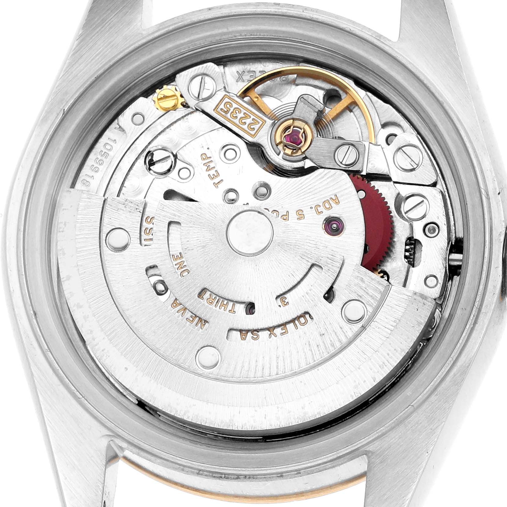 The image shows the movement of a Rolex Datejust 79173 Women
s Steel and Gold (two tone) Silver Dial watch from the back, highlighting the intricate mechanical components.