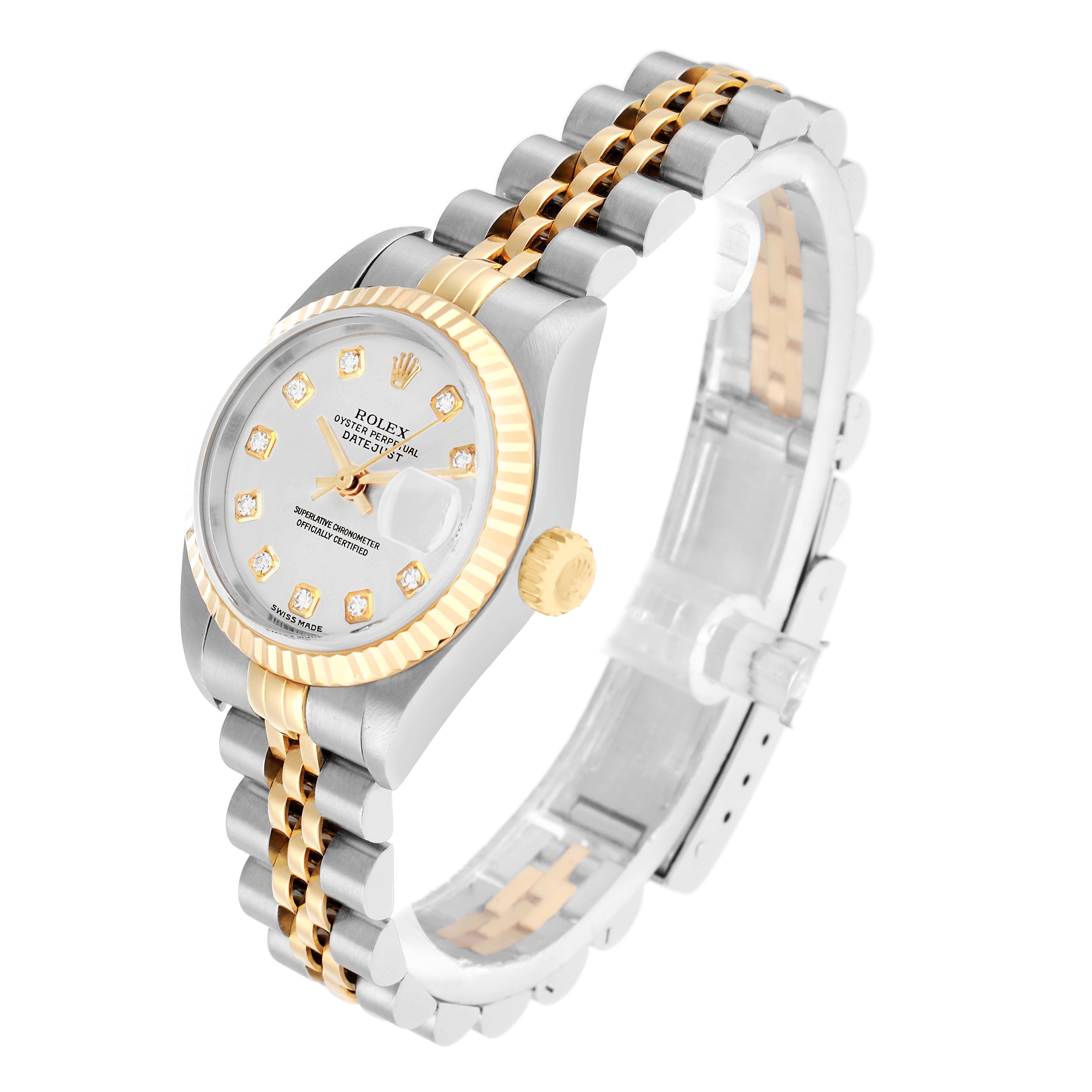The Rolex Datejust 79173 Women
s Steel and Gold (two tone) Silver Dial watch is shown at a three-quarter angle, highlighting the face, bezel, crown, and part of the bracelet.