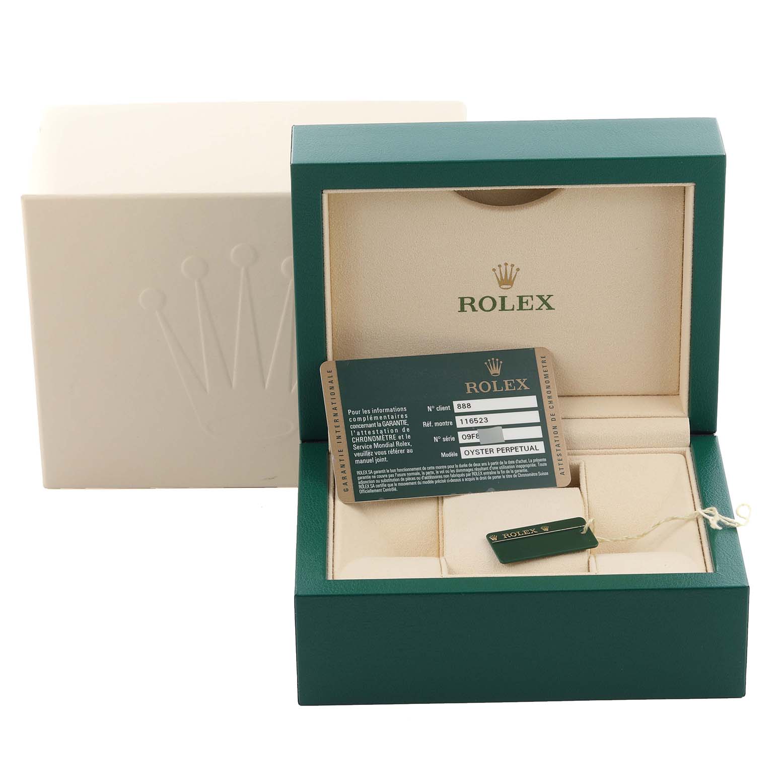 The image shows a Rolex Daytona 116523 Men's Steel and Gold (two tone) Black Dial 116523 Men's Steel and Gold (two tone) Black Dial watch box, card, and tag from a front angle.