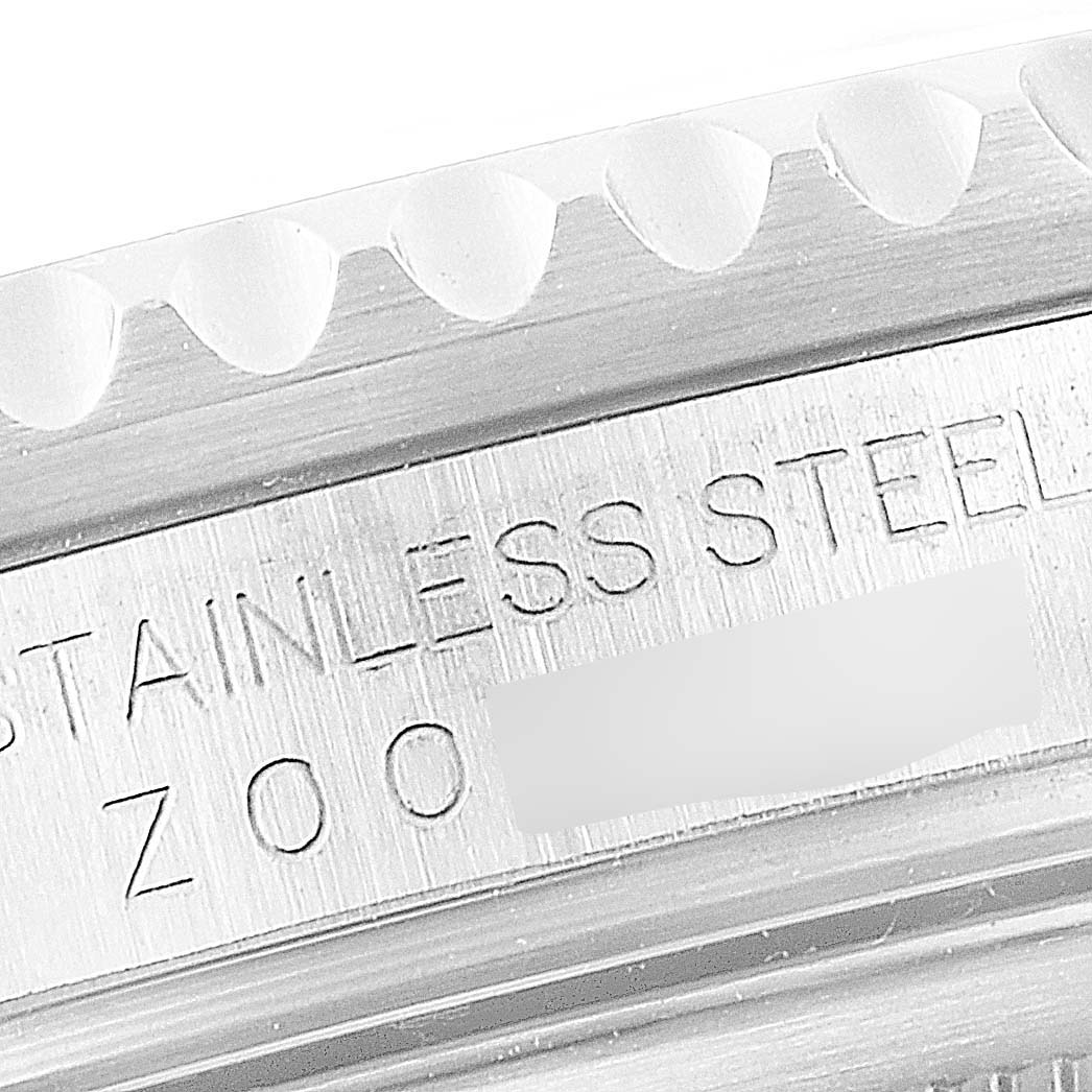 This close-up image of the Rolex GMT-Master 16710 Men
s Stainless Steel Black Dial 16710 Men
s Stainless Steel Black Dial watch shows the engraved text on the case, including "stainless steel."