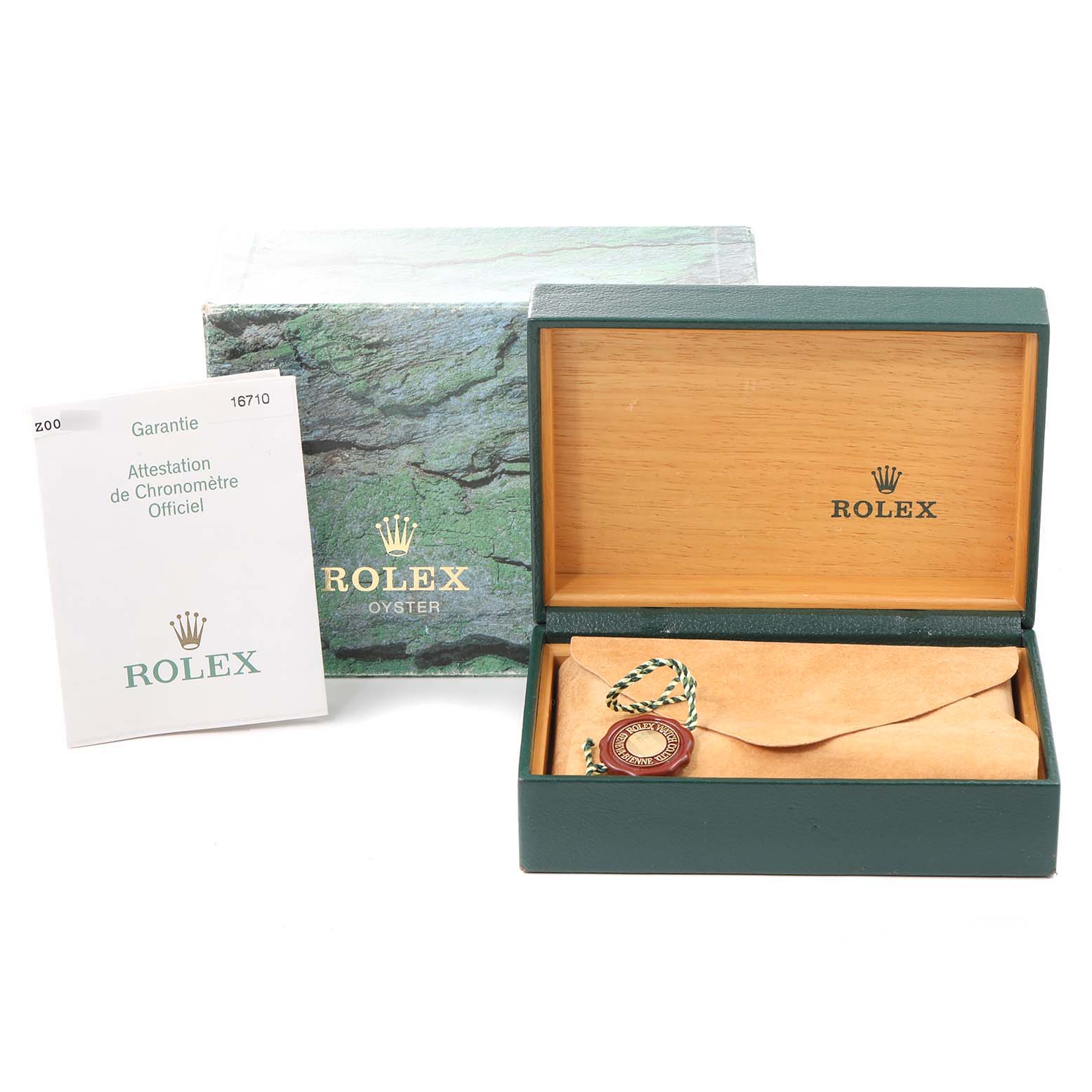 The image shows the packaging and accessories of a Rolex GMT-Master 16710 Men
s Stainless Steel Black Dial 16710 Men
s Stainless Steel Black Dial watch, including the box, warranty card, and tag.