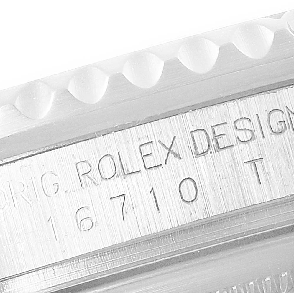This close-up image shows the bezel edge and model number engraving on a Rolex GMT-Master 16710 Men
s Stainless Steel Black Dial 16710 Men
s Stainless Steel Black Dial watch.