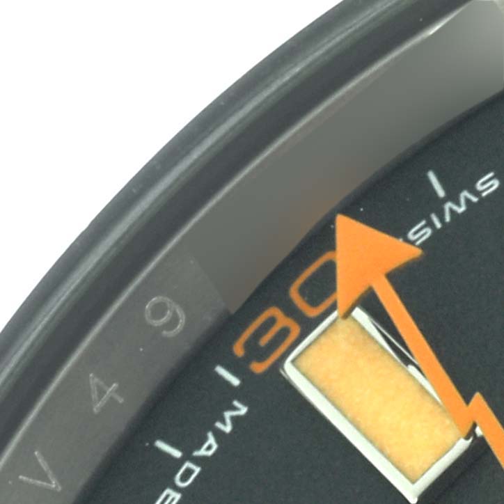 The image shows a close-up of the Rolex Milgauss 116400GV Men's Stainless Steel Black Dial 116400GV Men's Stainless Steel Black Dial watch dial, highlighting the orange seconds hand and hour markers.