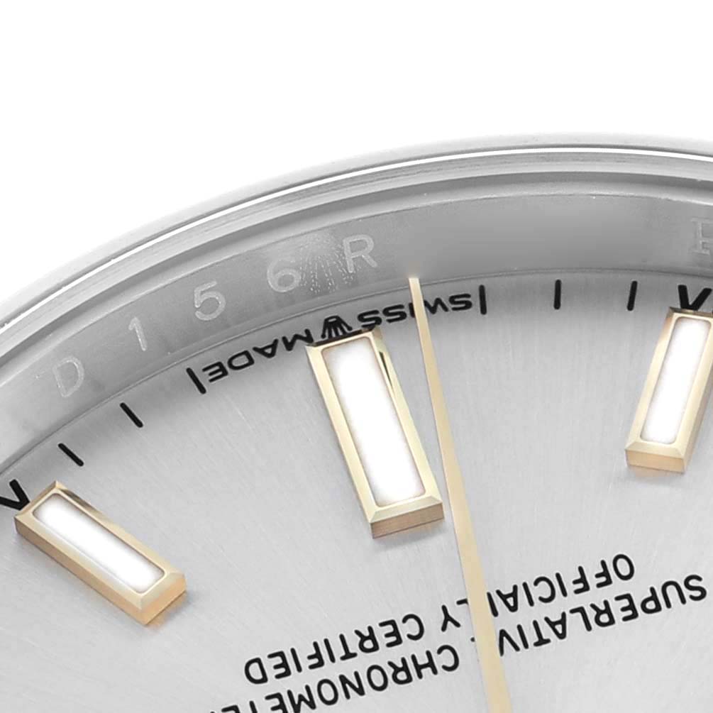 The image shows a close-up of the Rolex Oyster Perpetual 124200 Men
s Stainless Steel Silver Dial
s dial, focusing on hour markers and part of the minute track.
