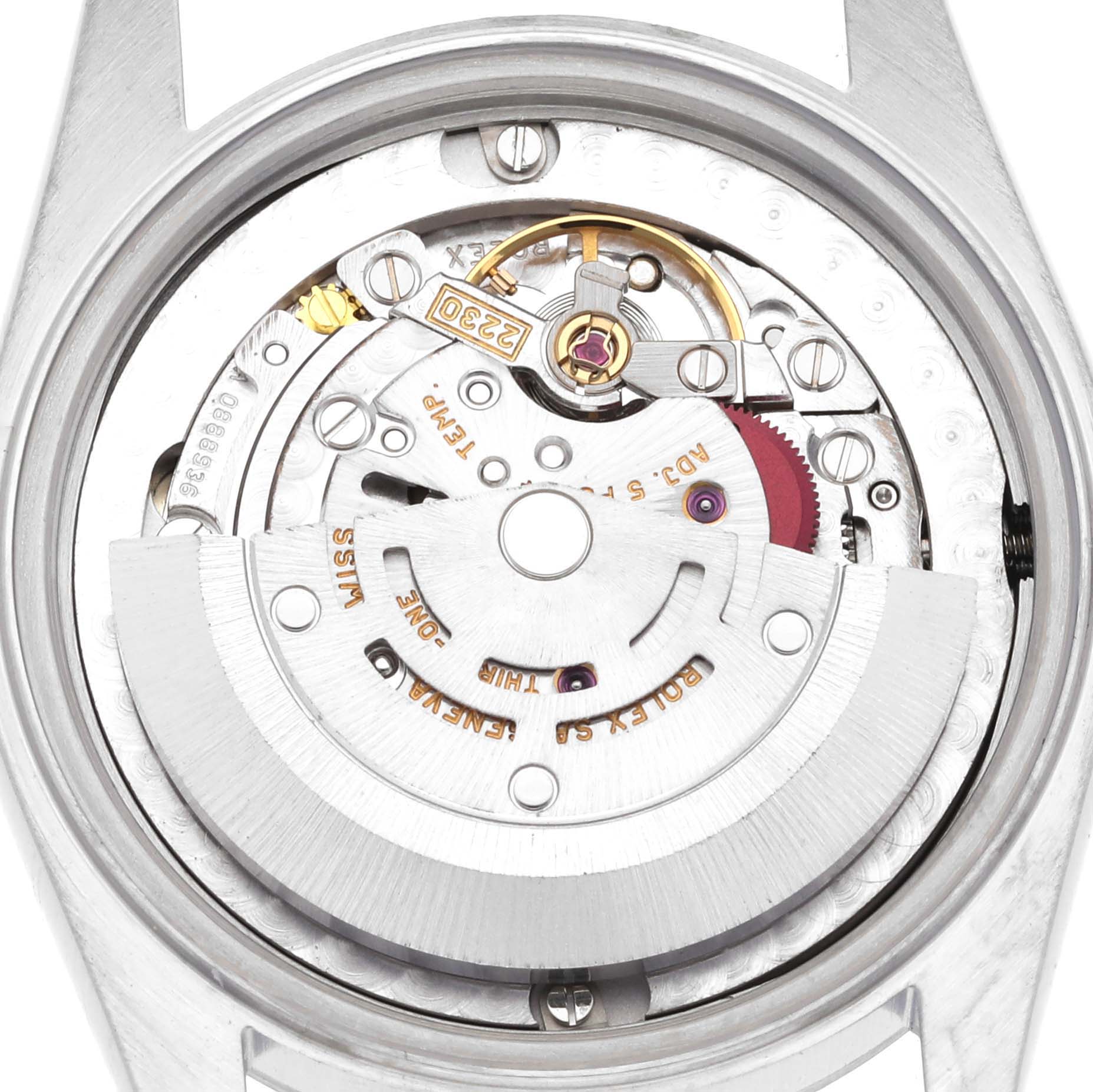 The image shows the open back of a Rolex Mid-Size 77080 Women's Stainless Steel Silver Dial 77080 Women's Stainless Steel Silver Dial model, revealing its internal mechanical movement.
