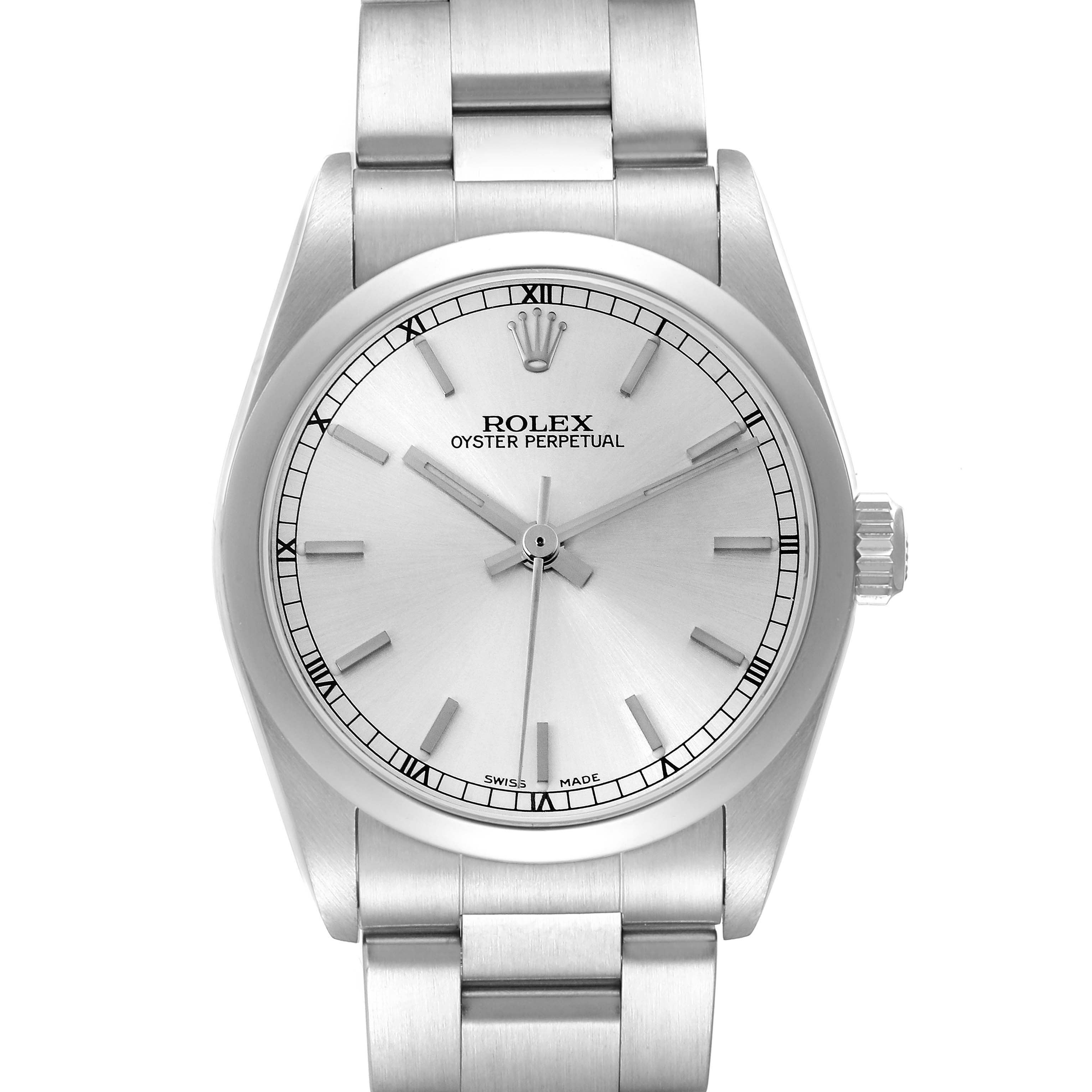 The Rolex Oyster Perpetual Mid-Size watch is shown from a front angle, highlighting the dial, crown, and bracelet.