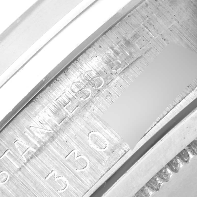 The image shows a close-up of the engraved inner rim of the Rolex Vintage Collection 6694 Men's Stainless Steel Silver Dial 6694 Men's Stainless Steel Silver Dial watch.