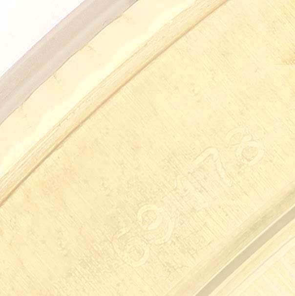 This close-up image shows the serial number engraving on the inner bezel of a Rolex President 69178 Women's Yellow Gold Champagne Dial 69178 Women's Yellow Gold Champagne Dial model watch.
