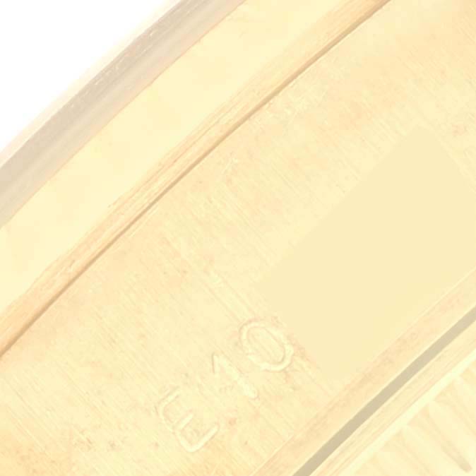 This image shows an extreme close-up of the band links from the Rolex President 69178 Women's Yellow Gold Champagne Dial 69178 Women's Yellow Gold Champagne Dial model watch.