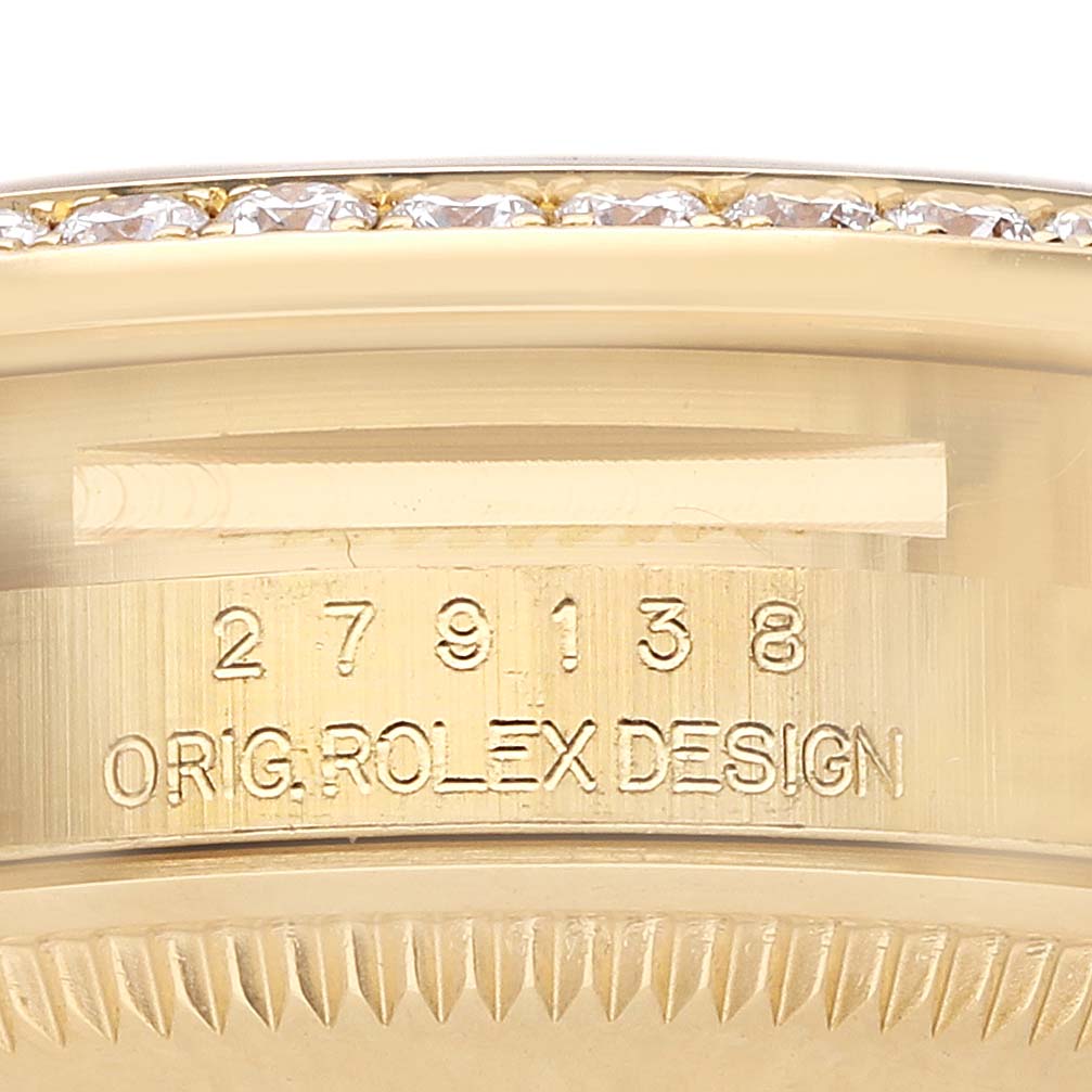 The image shows an angled close-up of the side of a Rolex President 279138 Women
s Yellow Gold Mother of Pearl Dial model, featuring the engraved serial number and "Orig. Rolex Design" text.