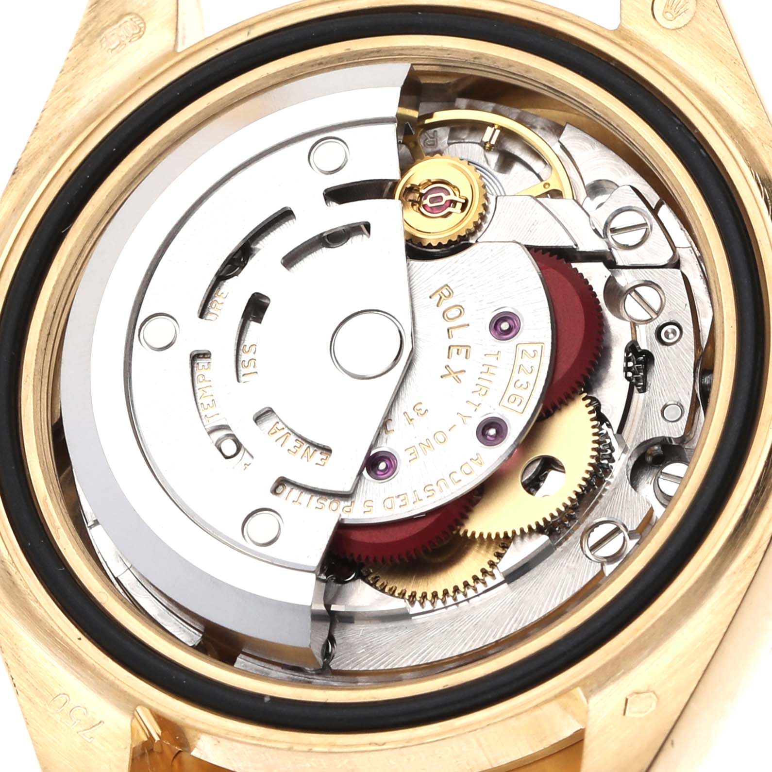 The image shows the inner mechanism of a Rolex President 279138 Women
s Yellow Gold Mother of Pearl Dial model watch from the back, highlighting gears and the rotor.