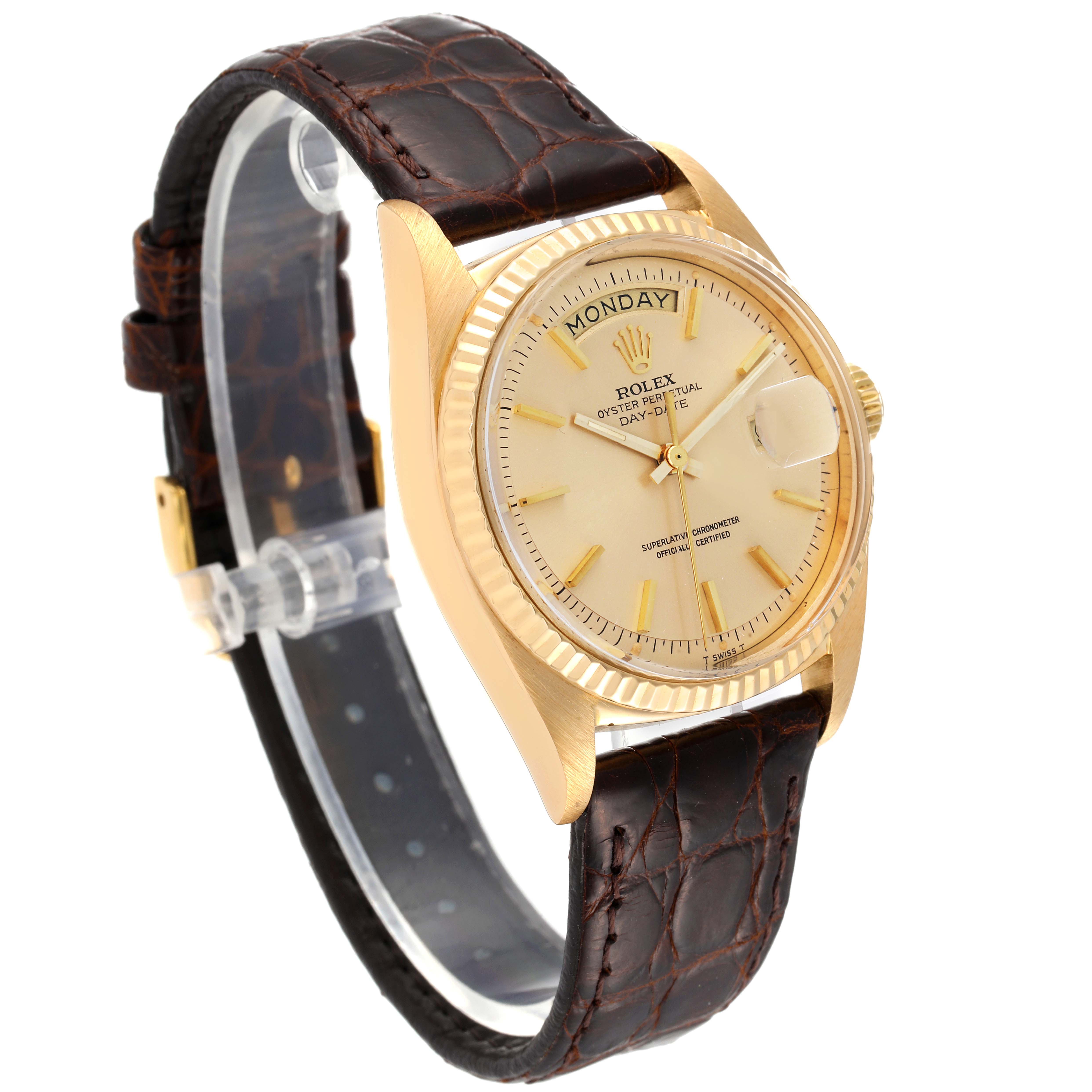 This image features a Rolex Day-Date watch with a gold casing and brown leather strap, shown at a three-quarter angle.