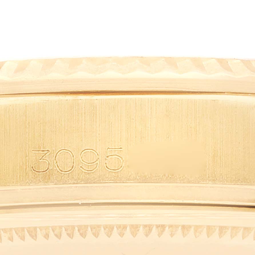 This image shows a close-up of the case side of a Rolex Milgauss 1803 Men's Yellow Gold Champagne Dial 1803 Men's Yellow Gold Champagne Dial watch, highlighting the engraved serial number.