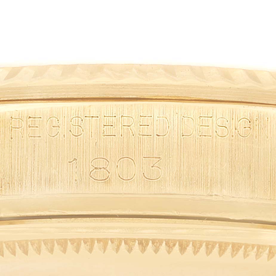 The image shows a close-up of the engraved case back of a Rolex Milgauss 1803 Men's Yellow Gold Champagne Dial 1803 Men's Yellow Gold Champagne Dial watch.