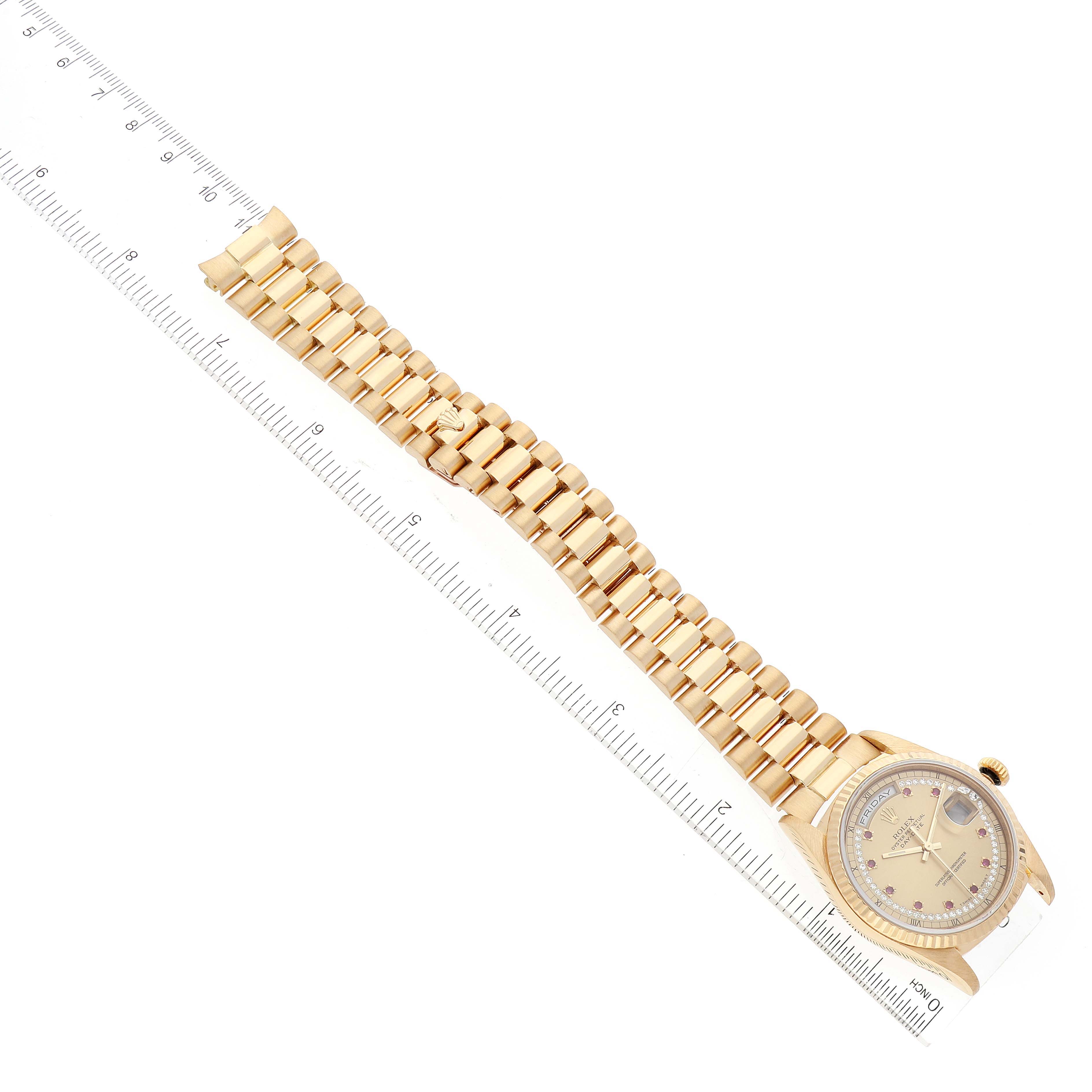 The image shows the Rolex President 18238 Men's Yellow Gold Champagne Dial 18238 Men's Yellow Gold Champagne Dial model watch lying flat with its bracelet extended, positioned next to a ruler.