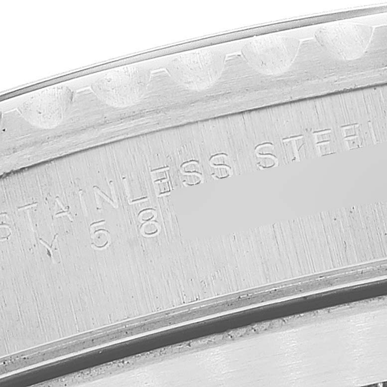 This image shows a close-up of the stainless steel back casing of a Rolex Submariner 14060 Men
s Stainless Steel Black Dial 14060 Men
s Stainless Steel Black Dial watch, highlighting its engraved details.