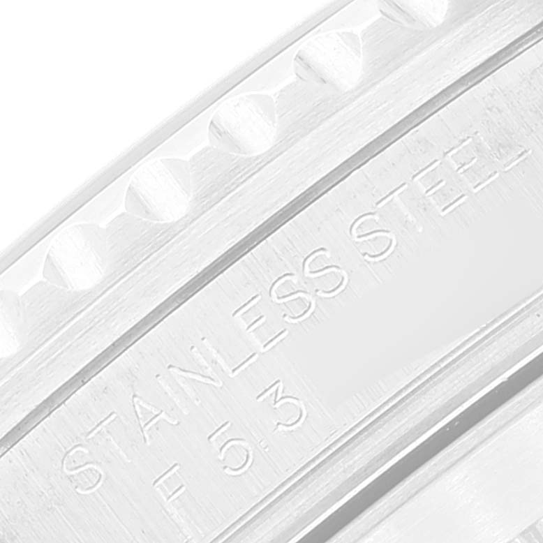 This image shows a close-up of the side engraving on the case of a Rolex Submariner 16610 Men
s Stainless Steel Black Dial 16610 Men
s Stainless Steel Black Dial, indicating "STAINLESS STEEL."