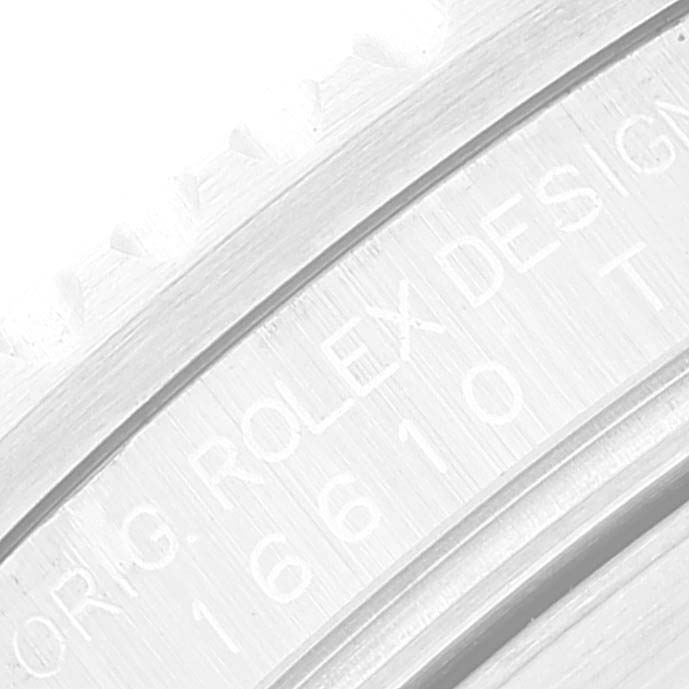 The image shows a close-up of the side of a Rolex Submariner 16610 Men
s Stainless Steel Black Dial 16610 Men
s Stainless Steel Black Dial, focusing on the engraved model number 16610T.